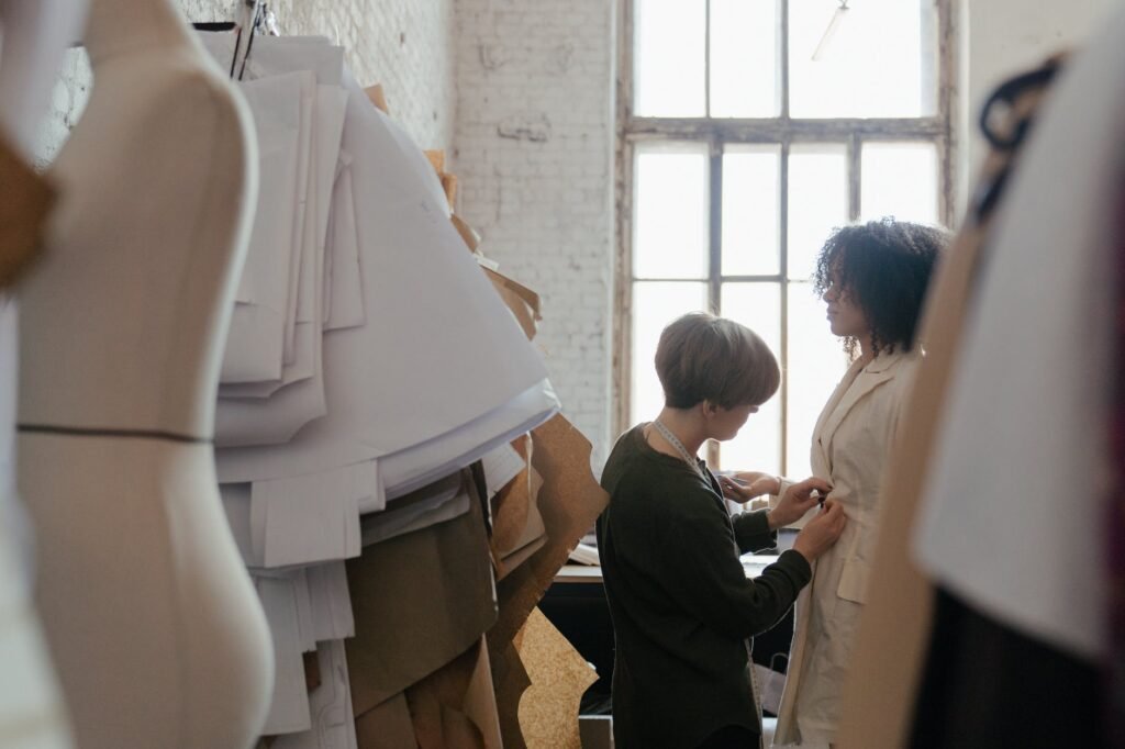 woman in white long sleeve shirt standing beside man in black suit
