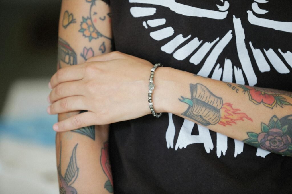 person with tattoos on arms