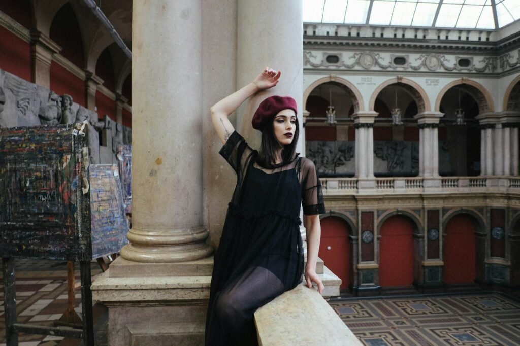 stylish dreamy model on stone fence in aged museum - mannequins russes