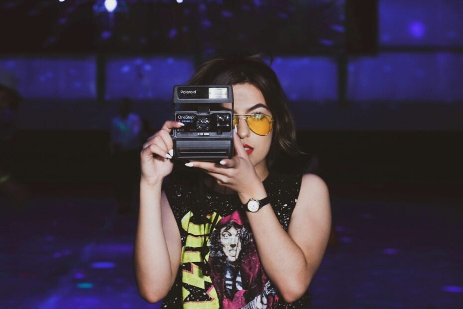 woman taking photo using camera